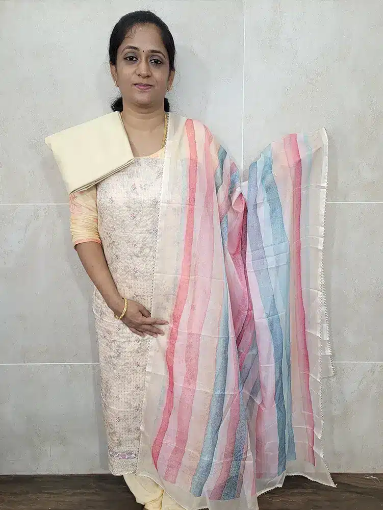 Embroidered organza top paired with a digital printed organza dupatta and cotton silk bottom(lining included)