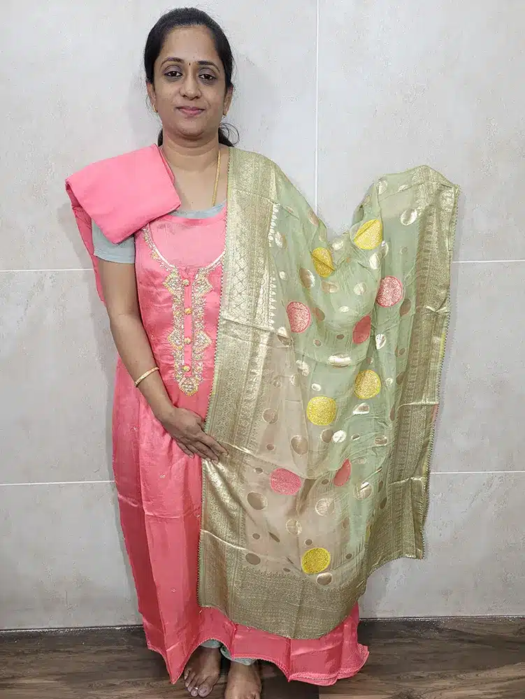 Dola silk top with embroidered yoke paired with a benaras weaved pure organza dupatta and cotton silk bottom