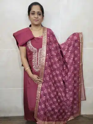 Pure dola silk top with embroidered yoke paired with a pure organza dupatta and cotton silk bottom