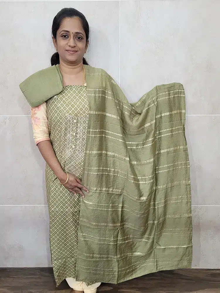 Printed modal silk top paired with a zari woven soft silk dupatta and cotton silk bottom