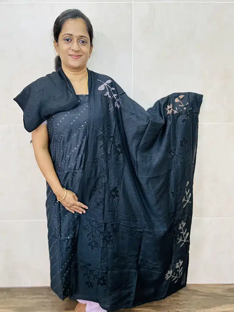 Soft silk top with allover sequence work paired with a cutworked soft silk dupatta and cotton silk bottom