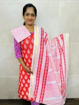 (Tomato red) Printed cottton top paired with a printed cotton dupatta and cotton bottom