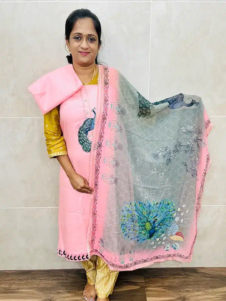 Soft cotton top with designer patch work on yoke paired with a printed pure chiffon dupatta and muslin cotton bottom