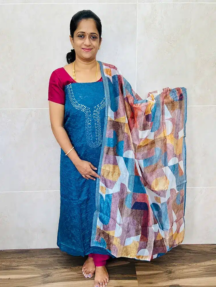 Embroidered organza top paired with a printed organza dupatta and silk bottom (lining included)