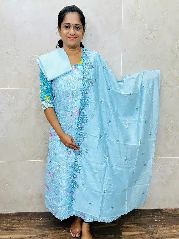Digital printed Chanderi silk top with allover cutwork paired with a soft silk dupatta and silk bottom