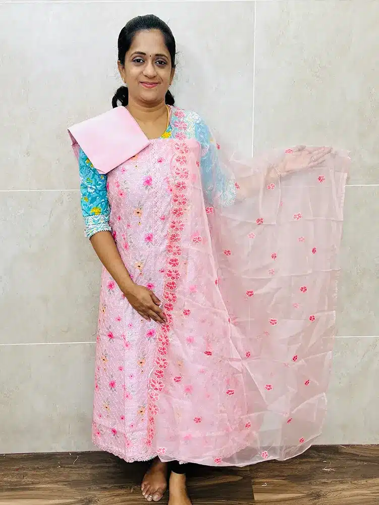 Digital printed Chanderi silk top with allover cutwork paired with organza dupatta and silk bottom