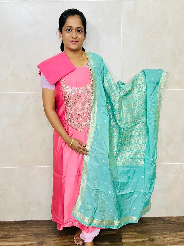 Muslin silk top with heavy handwork on yoke paired with Benaras soft silk dupatta and cotton silk bottom