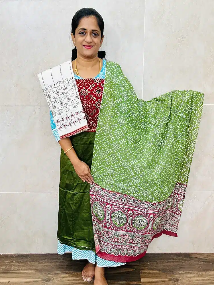 Cotton top with ajrakh patchwork on yoke paired with printed cotton dupatta and handworked cotton bottom