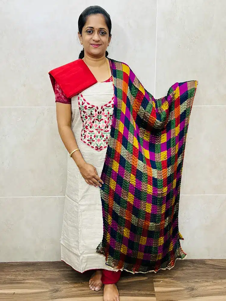 Semi Jute cotton top with embroidered yoke paired with crush silk dupatta and cotton bottom