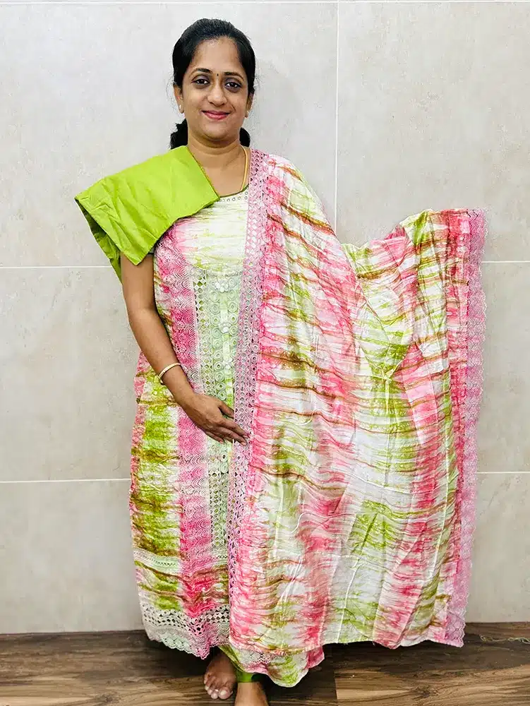 Muslin silk top with allover crochet lace work paired with muslin silk dupatta and cotton silk bottom