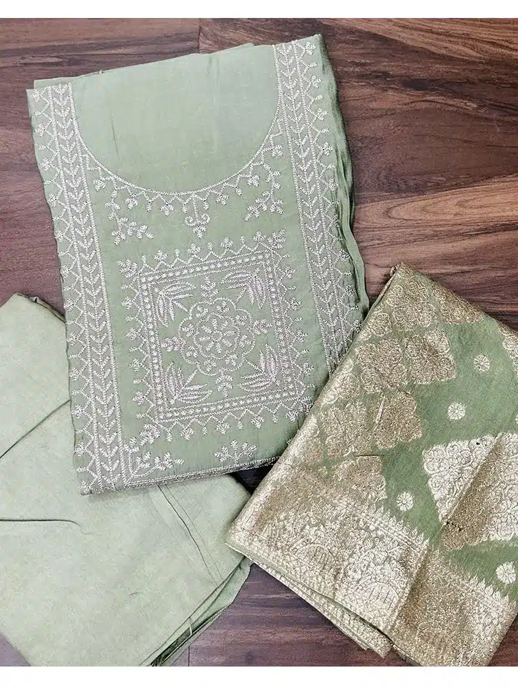 Premium muslin silk top with embroidered yoke paired with zari weaved soft silk dupatta and cotton silk bottom