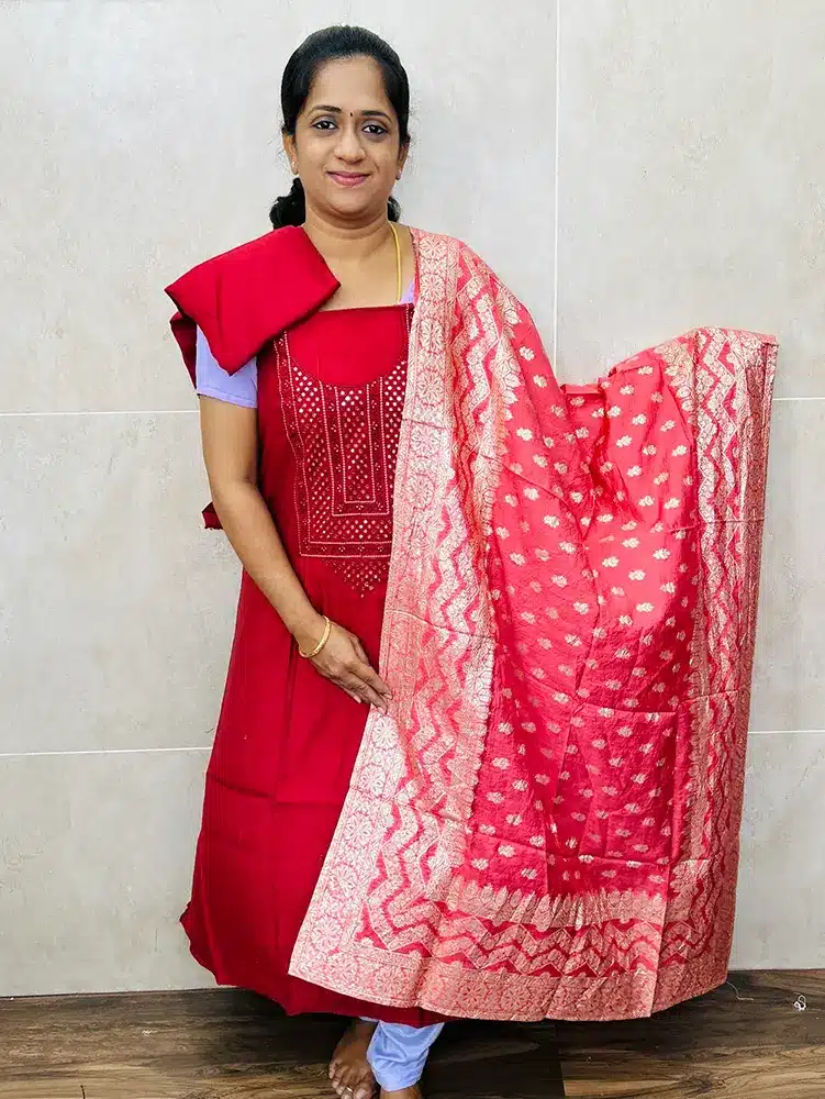 Premium modal silk top with embroidered yoke paired with zari weaved dola silk dupatta and cotton silk bottom