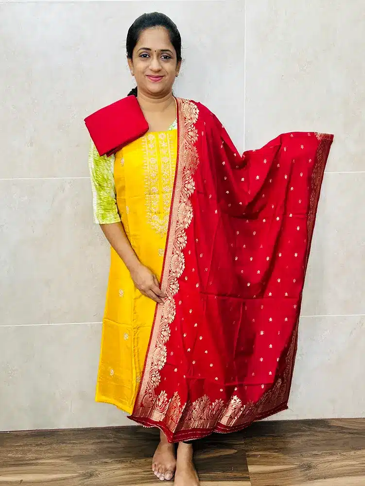 Premium dola silk top with allover embroidery paired with zari weaved dola silk dupatta and cotton silk bottom