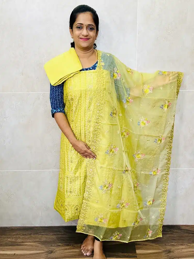 Soft Chanderi silk top with allover embroidery paired with embroidered organza dupatta and cotton silk bottom