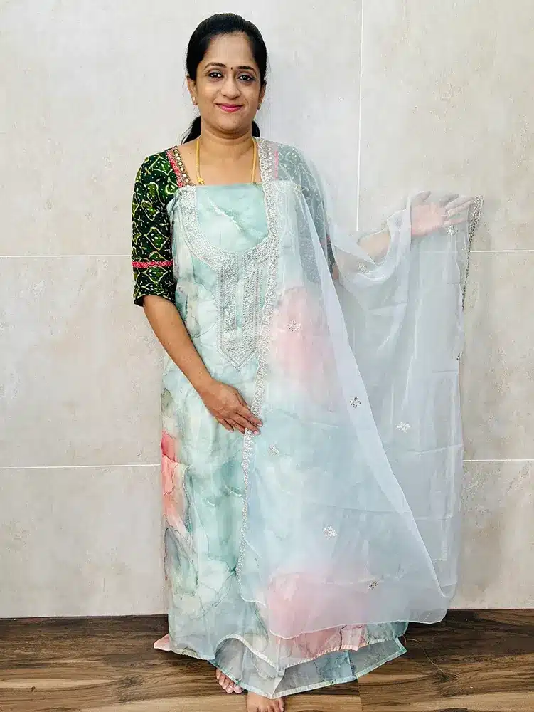 Digital printed organza top with embroidered yoke paired with embroidered organza dupatta and cotton silk bottom