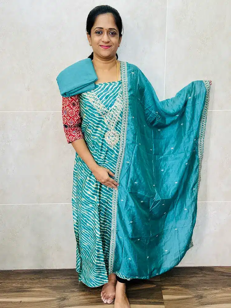 Premium modal silk top with designer neckwork paired with embroidered soft silk dupatta and cotton silk bottom