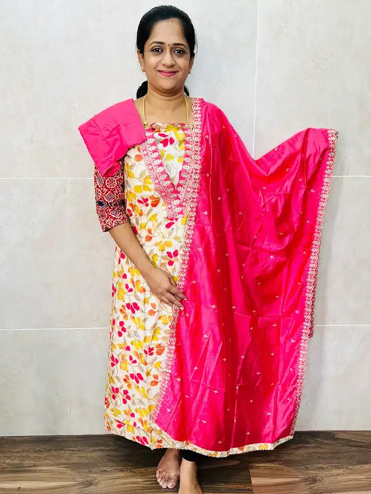 Premium modal silk top with designer neckwork paired with embroidered soft silk dupatta and cotton silk bottom