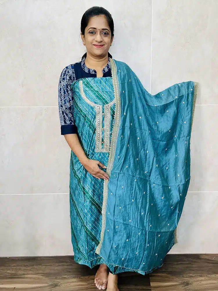 Printed modal silk top with embroidered yoke paired with embroidered soft silk dupatta and cotton silk bottom