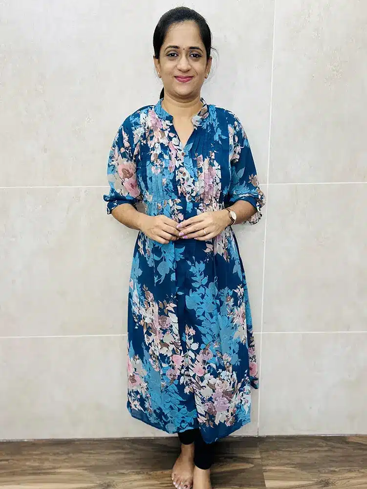 Printed Georgette top (crepe lining) with embroidered yoke, frilled flare and fancy elastic sleeve