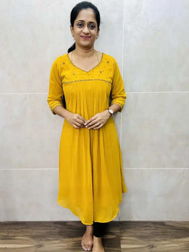 (Yellow)Faux Georgette top(crepe lining including sleeves)with elegant handwork on yoke and pleated flare(Aline pattern)