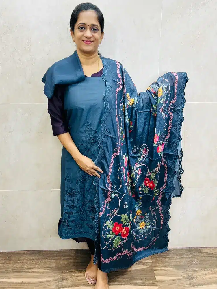 Pure muslin silk top with cutwork paired with muslin silk dupatta and santoon bottom