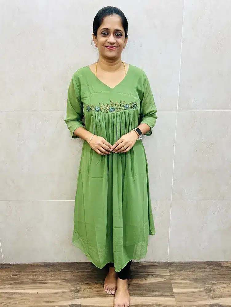 Pista green - Georgette top (crepe lining) with pleated flare and handworked yoke (Aline pattern)