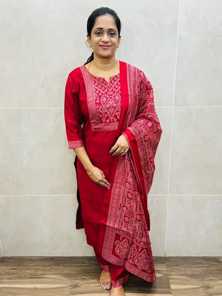 Red - Soft muslin silk top (crepe lining) with Ajrakh patchwork on yoke paired with printed muslin silk dupatta and muslin silk bottom