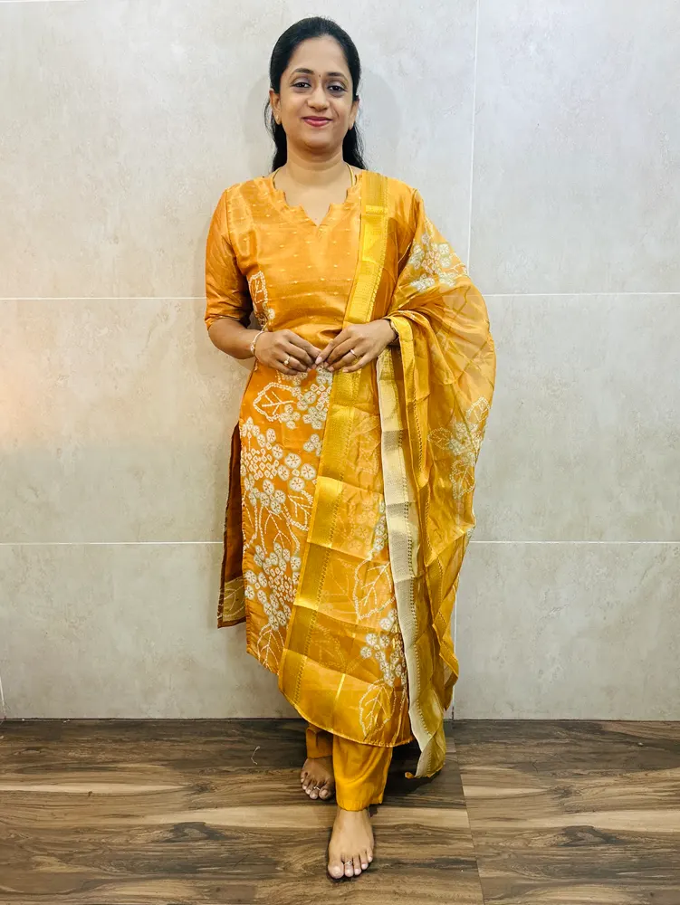 Soft tissue silk top (cotton lining) with allover zari woven buttas paired with printed soft organza dupatta and silk bottom (free size)