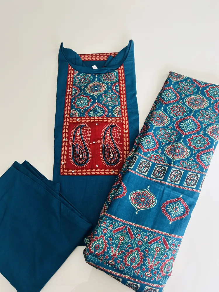 Pure cotton top (cotton lining) with mirror worked Ajrakh patchwork on yoke paired with printed muslin silk dupatta and cotton bottom (free size)