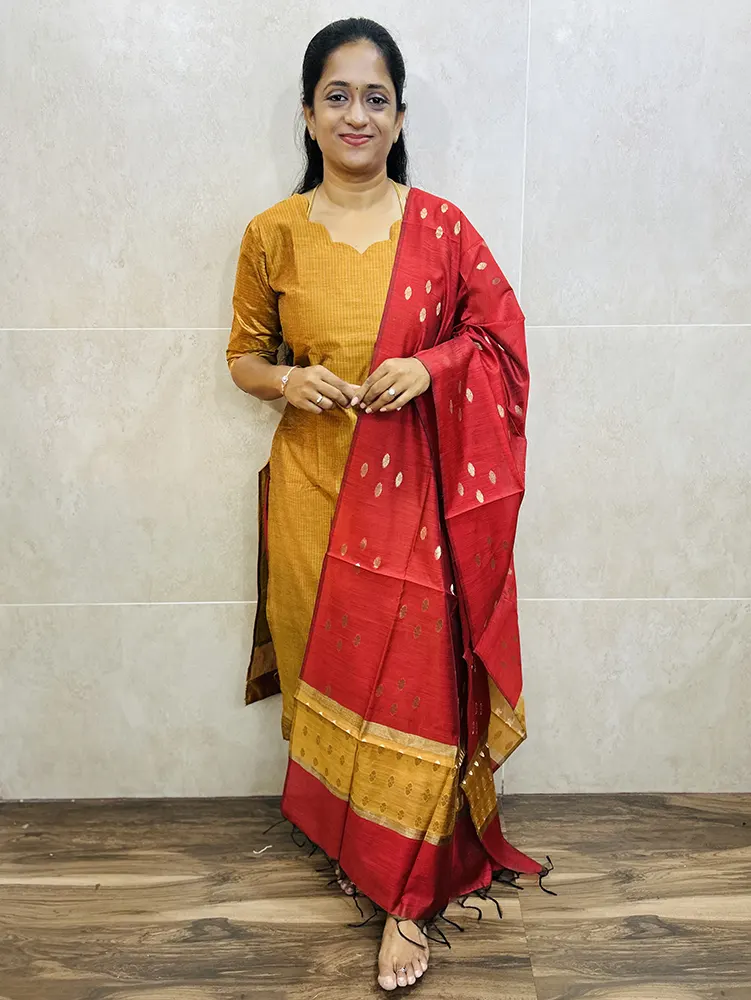 Semi Maheshwari silk top (cotton lining) with allover zari woven buttas paired with semi Maheshwari silk dupatta and silk cotton bottom (Free size)