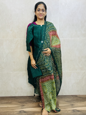 Soft silk top (cotton lining) with Potli work on yoke paired with mirror worked bhandini Dupatta and silk bottom (free size)