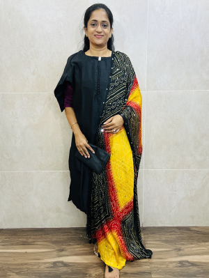 Black - Soft silk top (cotton lining) with Potli work on yoke paired with mirror worked bhandini Dupatta and silk bottom (free size)