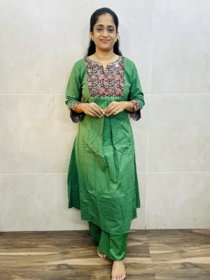 Premium cotton top (Aline -1 side pocket) with mirror work on yoke and sleeves paired with premium cotton bottom (semi palazzo)